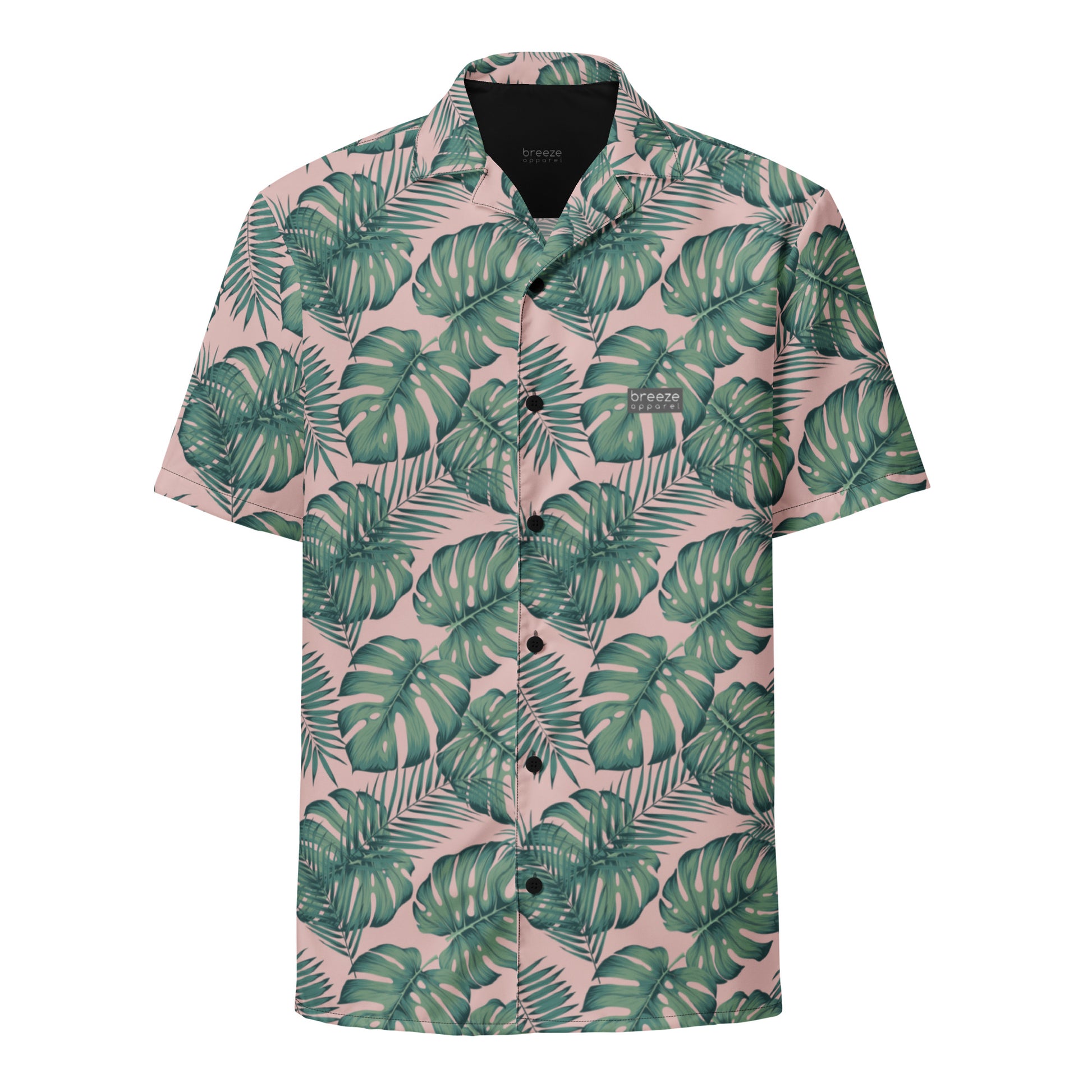 Button-down shirt with pattern of green palm leaves set on a pink background.
