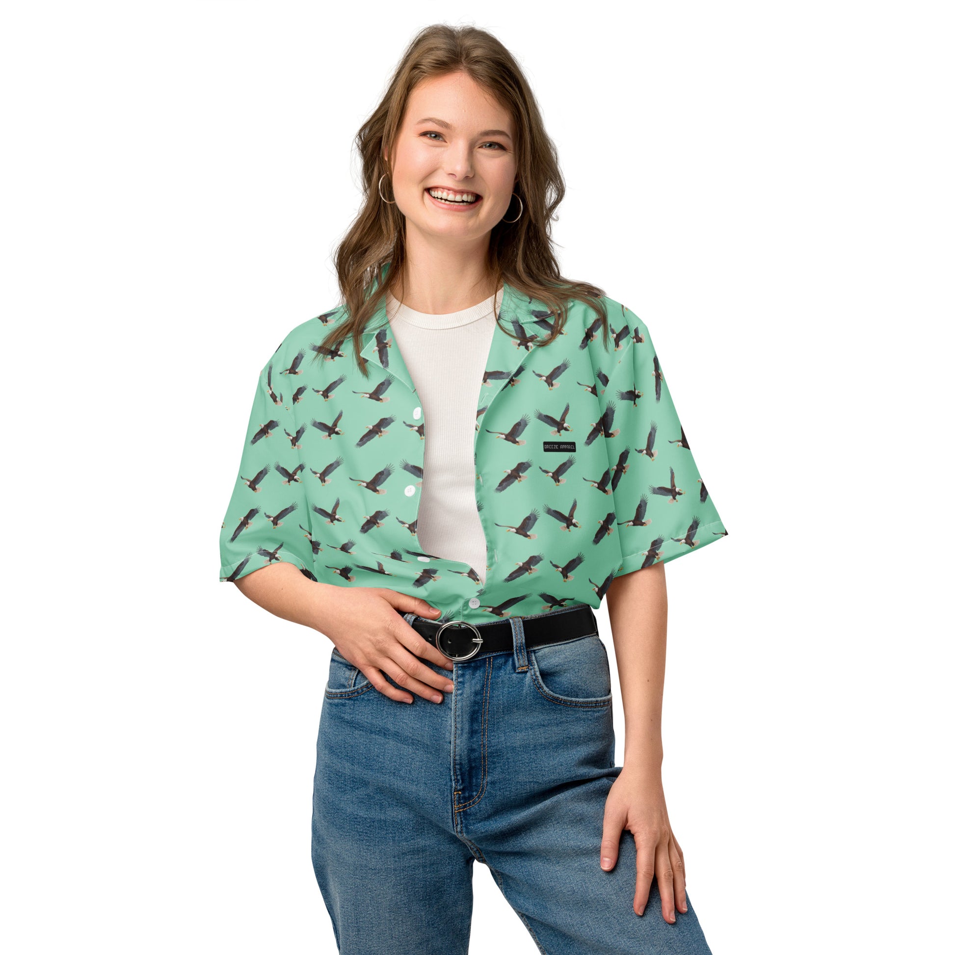 Woman wearing green button-down shirt with pattern of bald eagles.