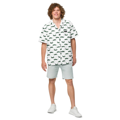 Man wearing white button-down shirt with pattern of green alligators.