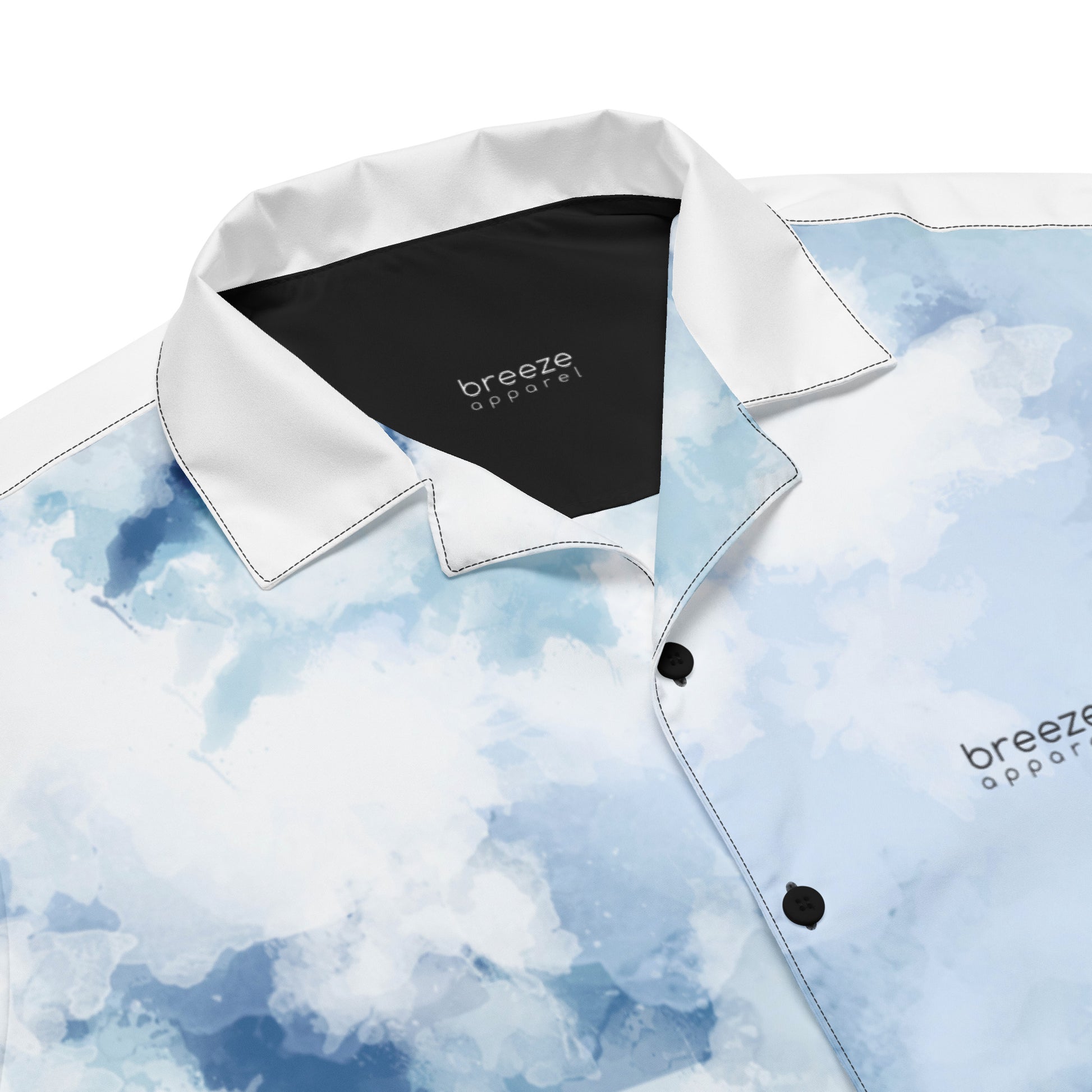 Button-down shirt with blue-white pattern resembling watercolor.