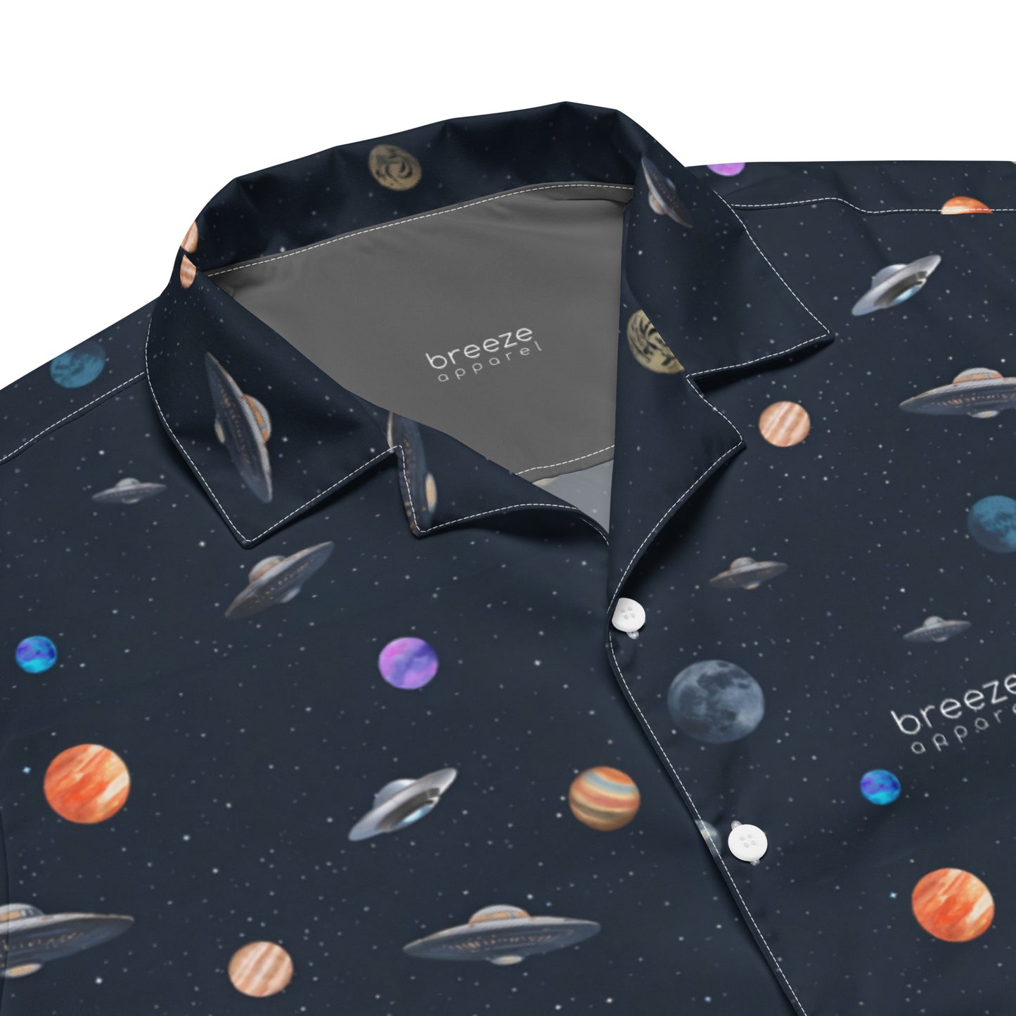 Button-down shirt with pattern of UFOs and planets in space.