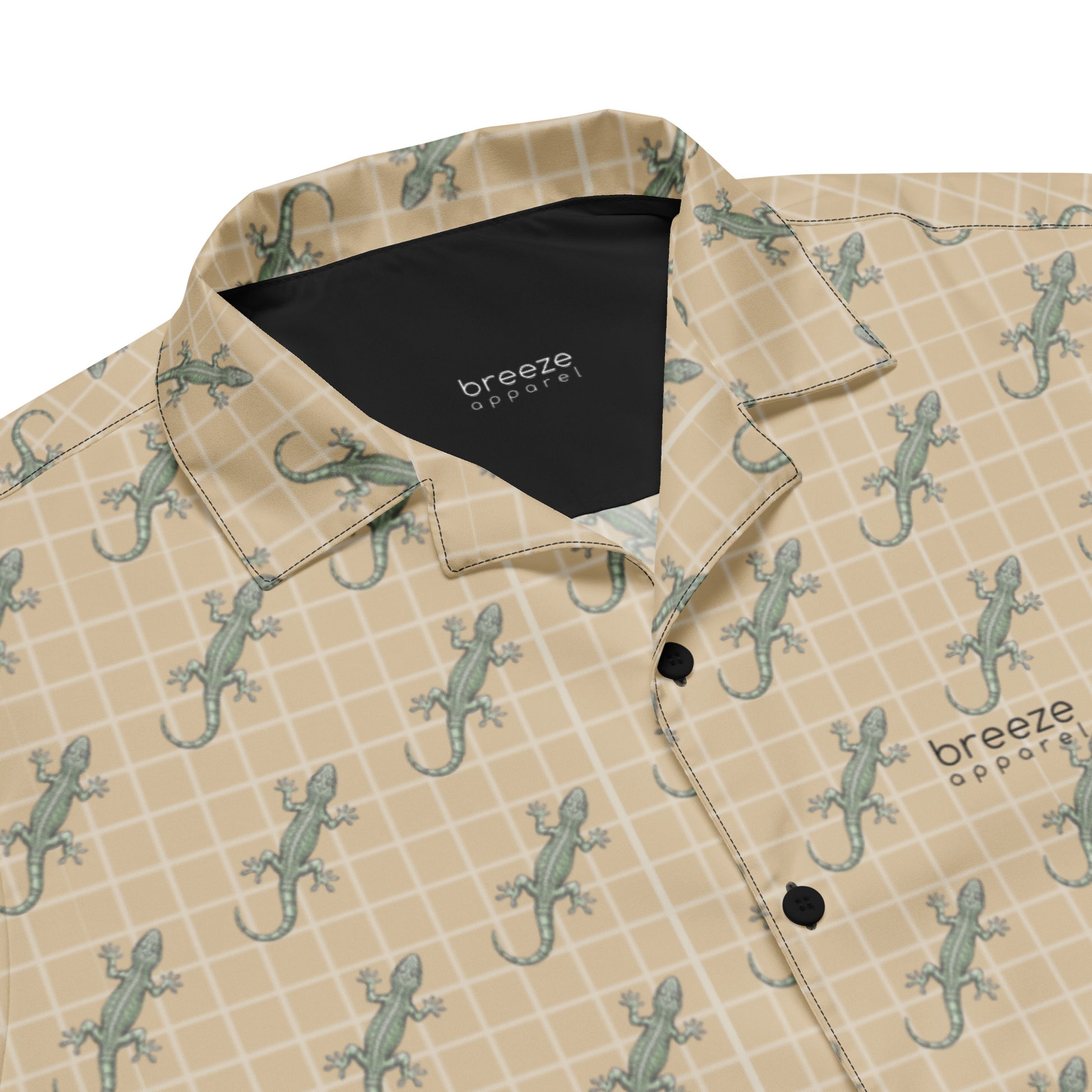 Beige button-down shirt with pattern of green geckos.