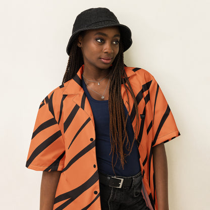 Woman wearing button-down shirt with tigerskin pattern.
