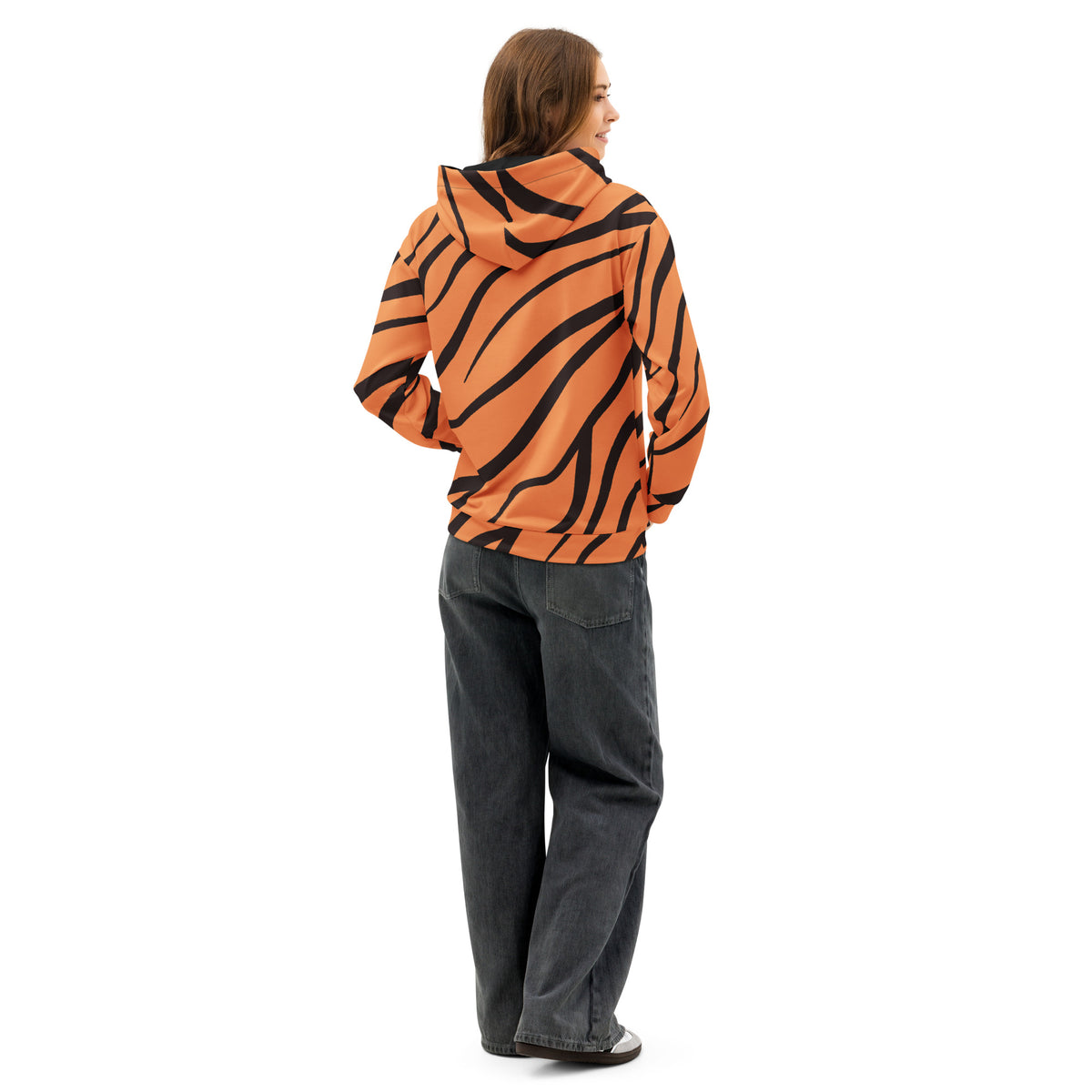 Rear view of woman wearing hoodie with a tiger-print design