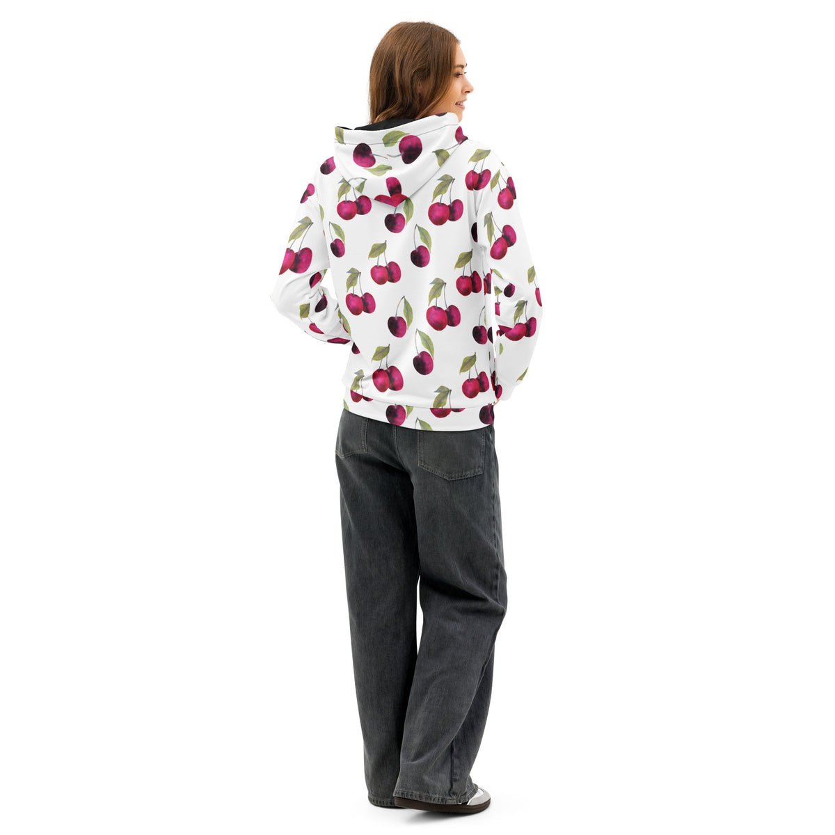 Rear view of woman wearing a white hoodie with an all-over cherries design.