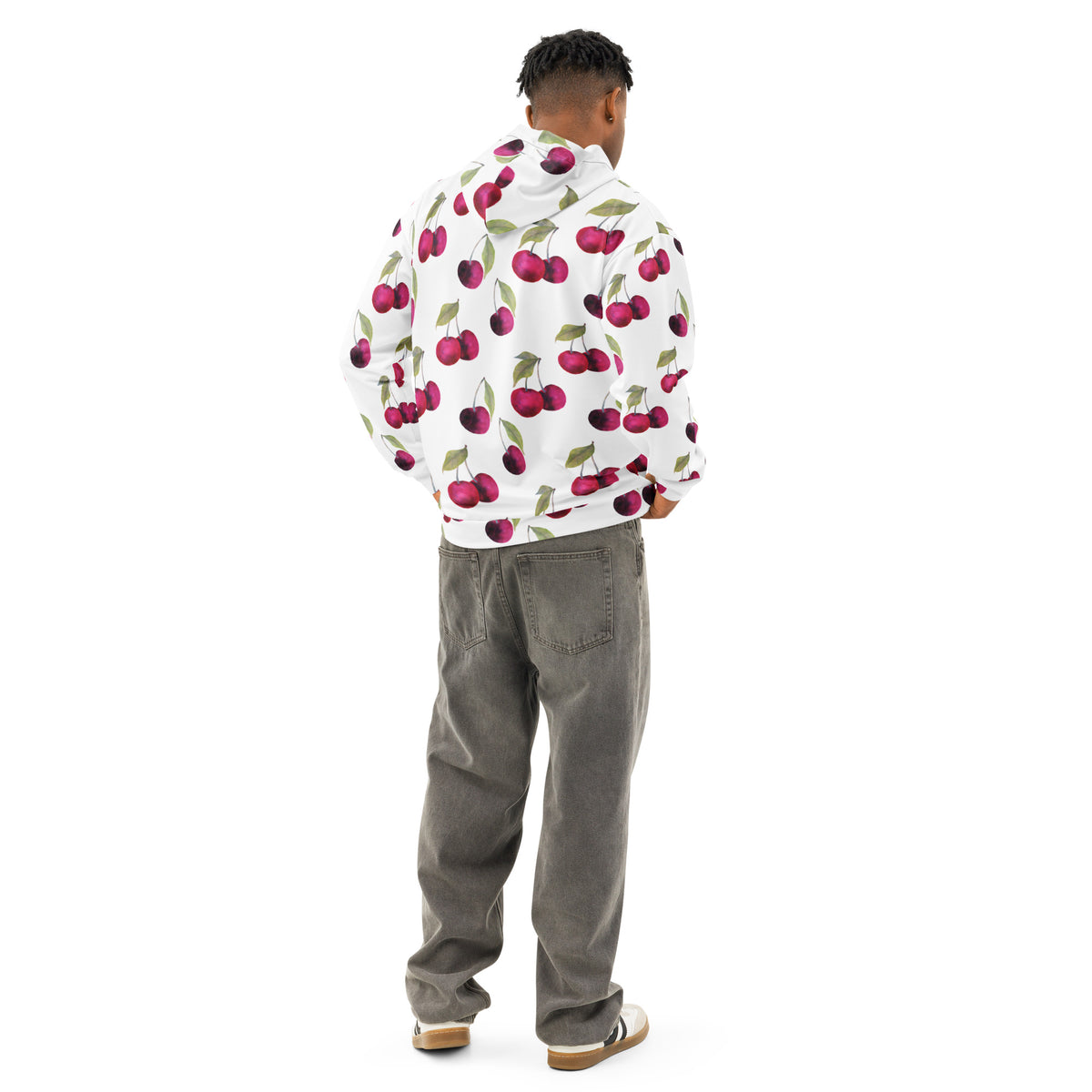 Rear view of man wearing a white hoodie with an all-over cherries design.