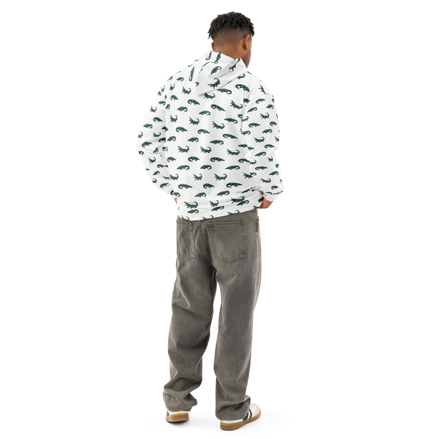 Man wearing white sweatshirt with pattern of green alligators.