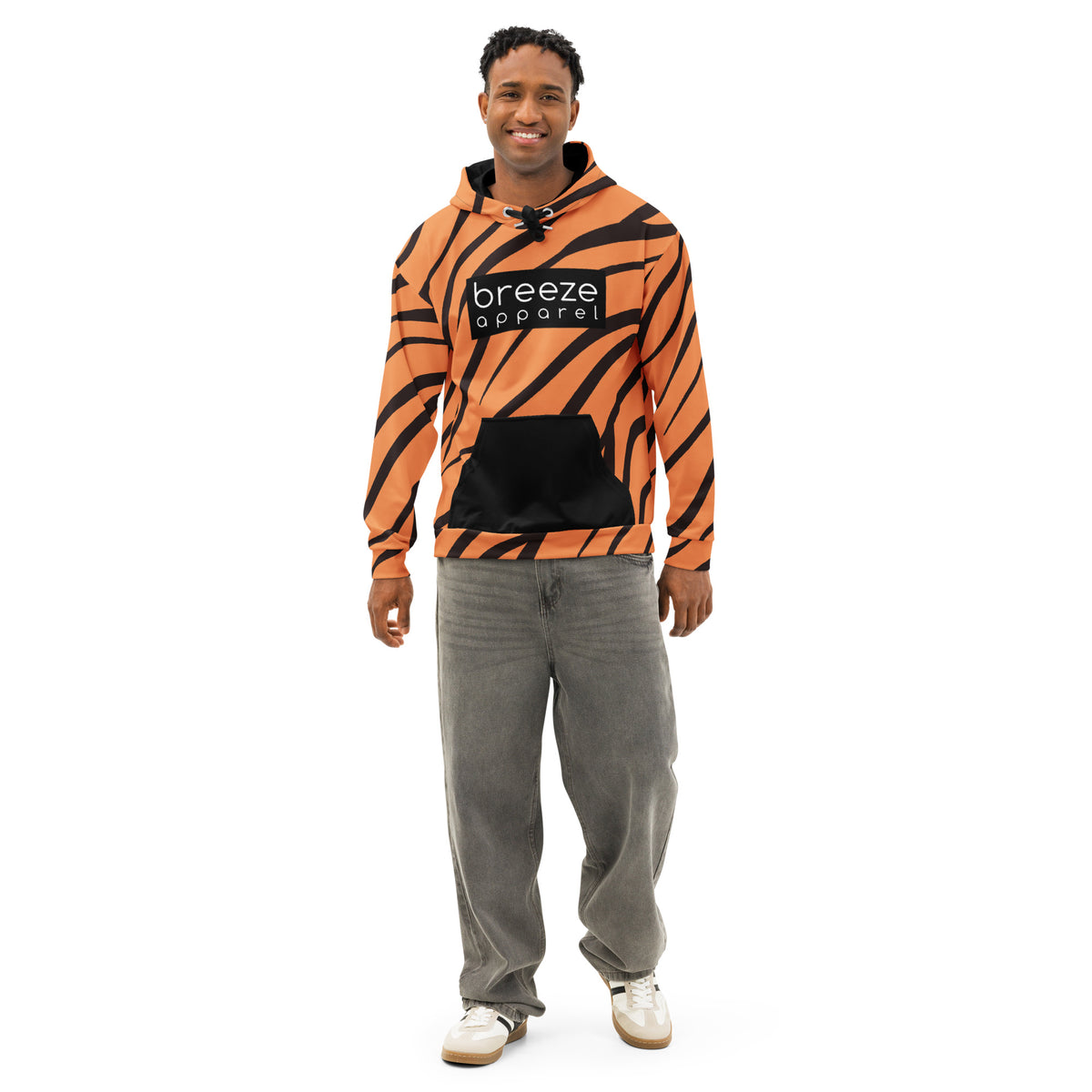 Man wearing hoodie with a tiger-fur design, with a black pocket, black drawstrings, and a 'breeze apparel' logo consisting of white wording set in a black rectangle across the chest.