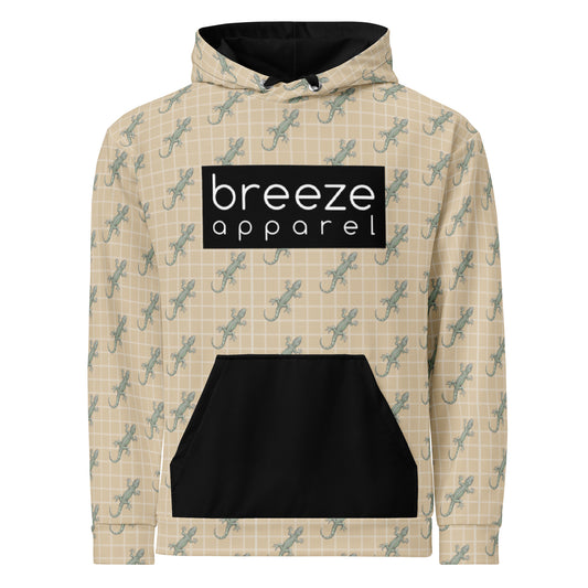 Beige hoodie with pattern of green geckos and black, rectangular logo with white lettering across chest. Hood interior, drawstrings, and pocket are black.