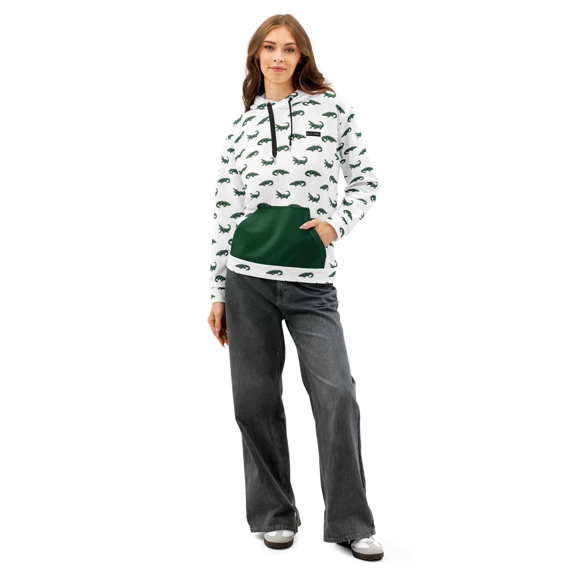 White sweatshirt with pattern of green alligators. Pocket is green, drawstrings are black.