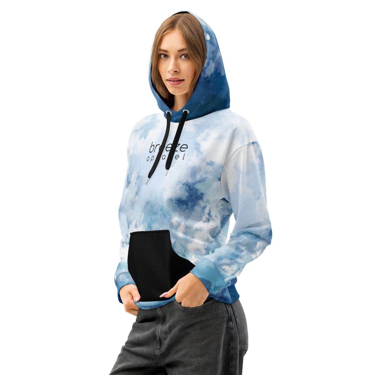 Woman wearing hoodie with a blue watercolor-style design, black pocket, black drawstrings, and a black 'breeze apparel' logo on the chest.