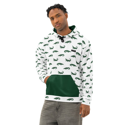 Man wearing white sweatshirt with pattern of green alligators. Hood interior and pocket are green, drawstrings are black.