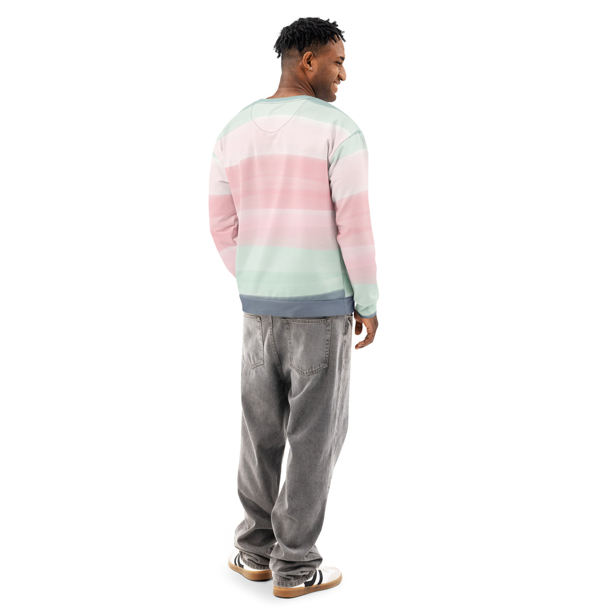 Rear view of man wearing sweatshirt with colors light pastel green, shades of pink, and gray in stripes.