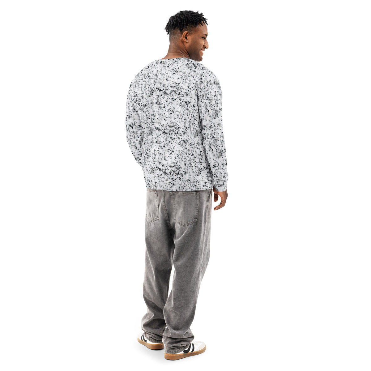 Rear view of a man wearing a white sweatshirt with black splotches, resembling a marble countertop. Across the chest is a black rectangle with 'breeze apparel' written in white.