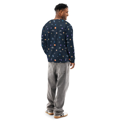 Rear view of man wearing sweatshirt with pattern of UFOs and planets in space.