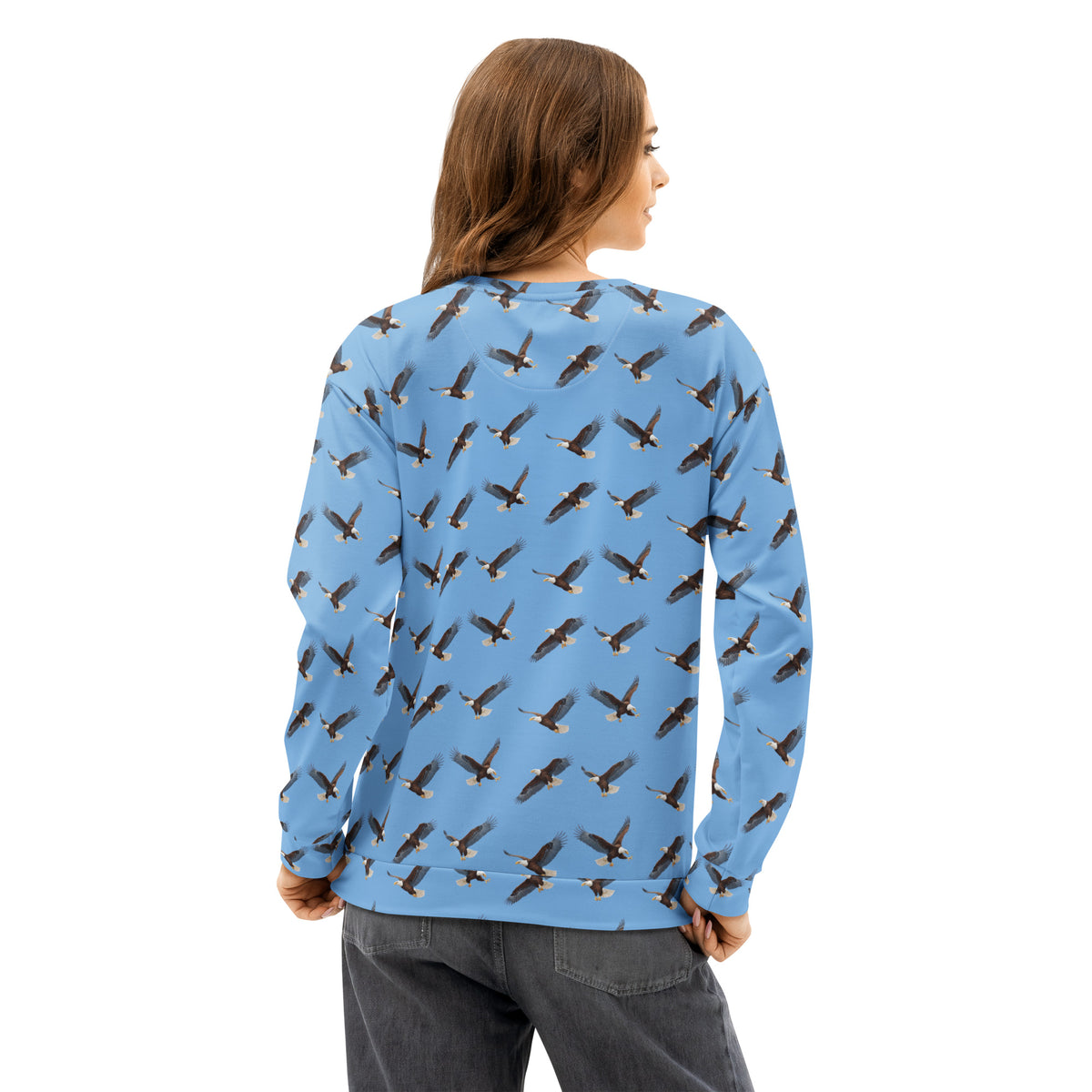 Woman wearing blue sweatshirt with pattern of bald eagles.