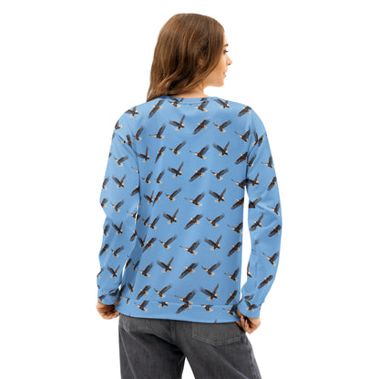 Woman wearing blue sweatshirt with pattern of bald eagles.