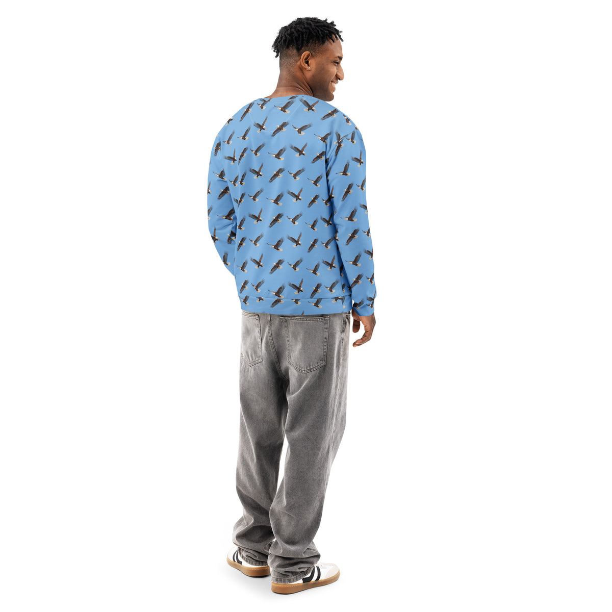Man wearing blue sweatshirt with pattern of bald eagles.