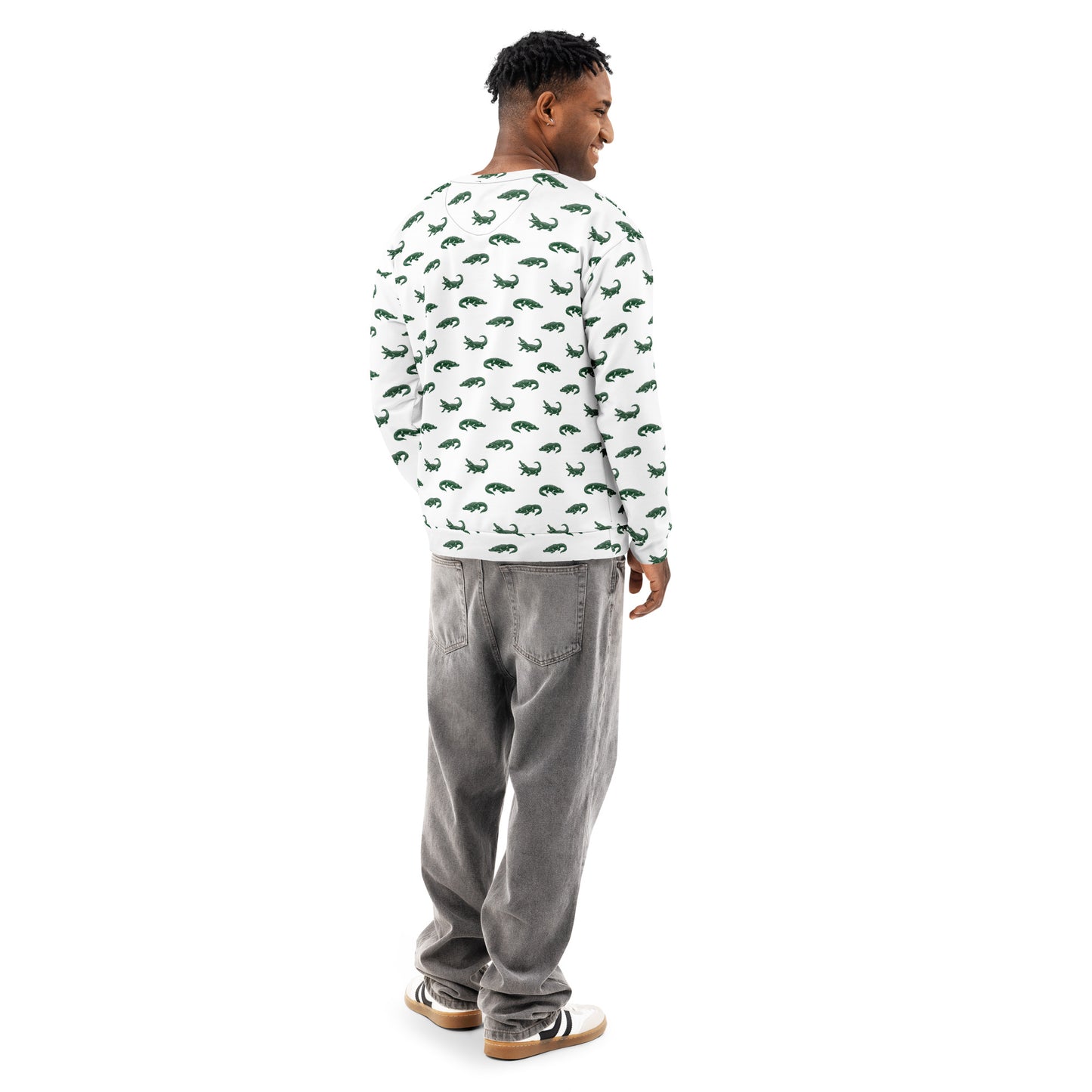 Man wearing white sweatshirt with pattern of green alligators.