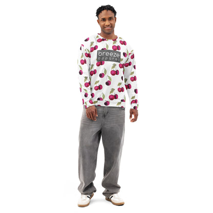 Man wearing a white hoodie with an all-over cherries design. Across the chest is a gray rectangle with 'breeze apparel' in white inside. Hood interior, drawstrings, and pocket are black.