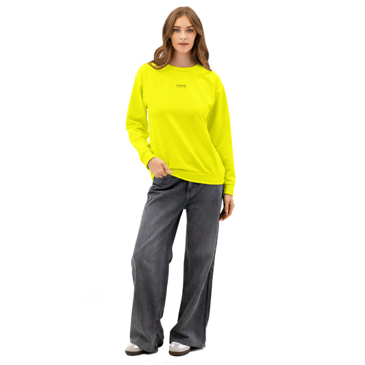 Woman wearing yellow sweatshirt with 'breeze apparel' in small, black text on chest.