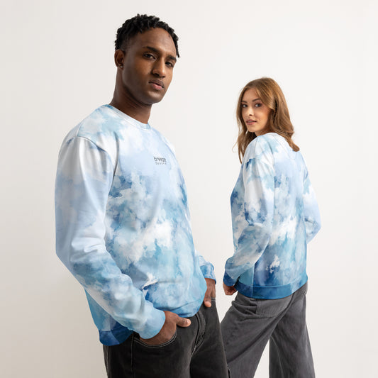 Man and woman, each wearing sweatshirt with a blue watercolor-style with a black 'breeze apparel' logo on the chest. Front is shown on man; backside shown on woman.