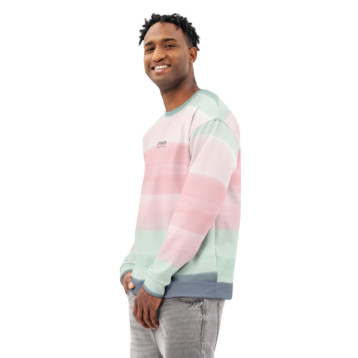 Man wearing sweatshirt with colors light pastel green, shades of pink, and gray in stripes, and 'breeze apparel' written in small text on chest.