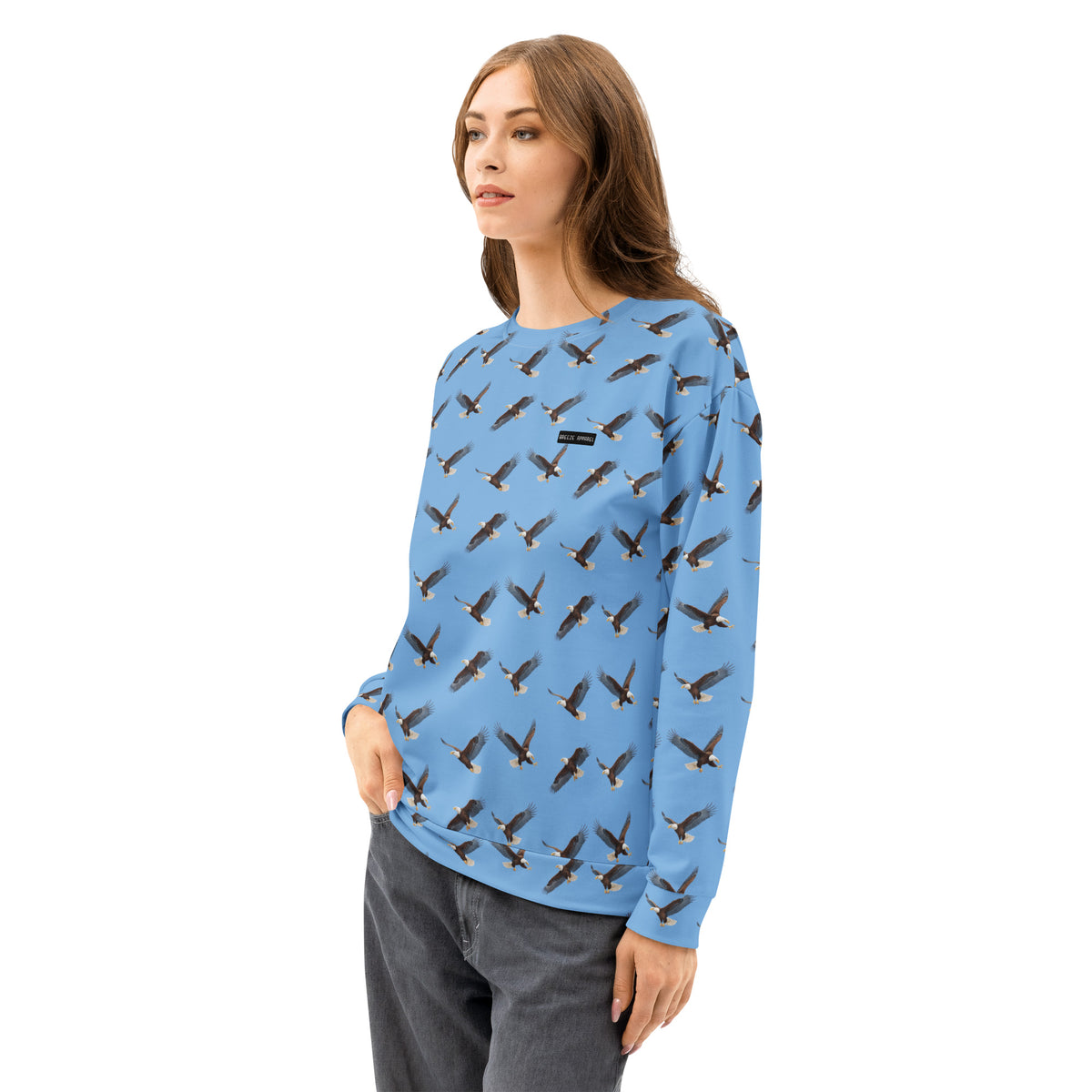 Woman wearing blue sweatshirt with pattern of bald eagles.