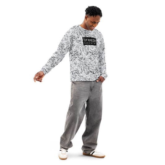 Man wearing a white sweatshirt with black splotches, resembling a marble countertop. Across the chest is a black rectangle with 'breeze apparel' written in white.