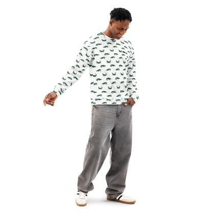 Man wearing white sweatshirt with pattern of green alligators.