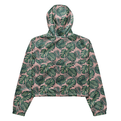 Back of cropped jacket with pattern of green palm leaves set on a pink background.