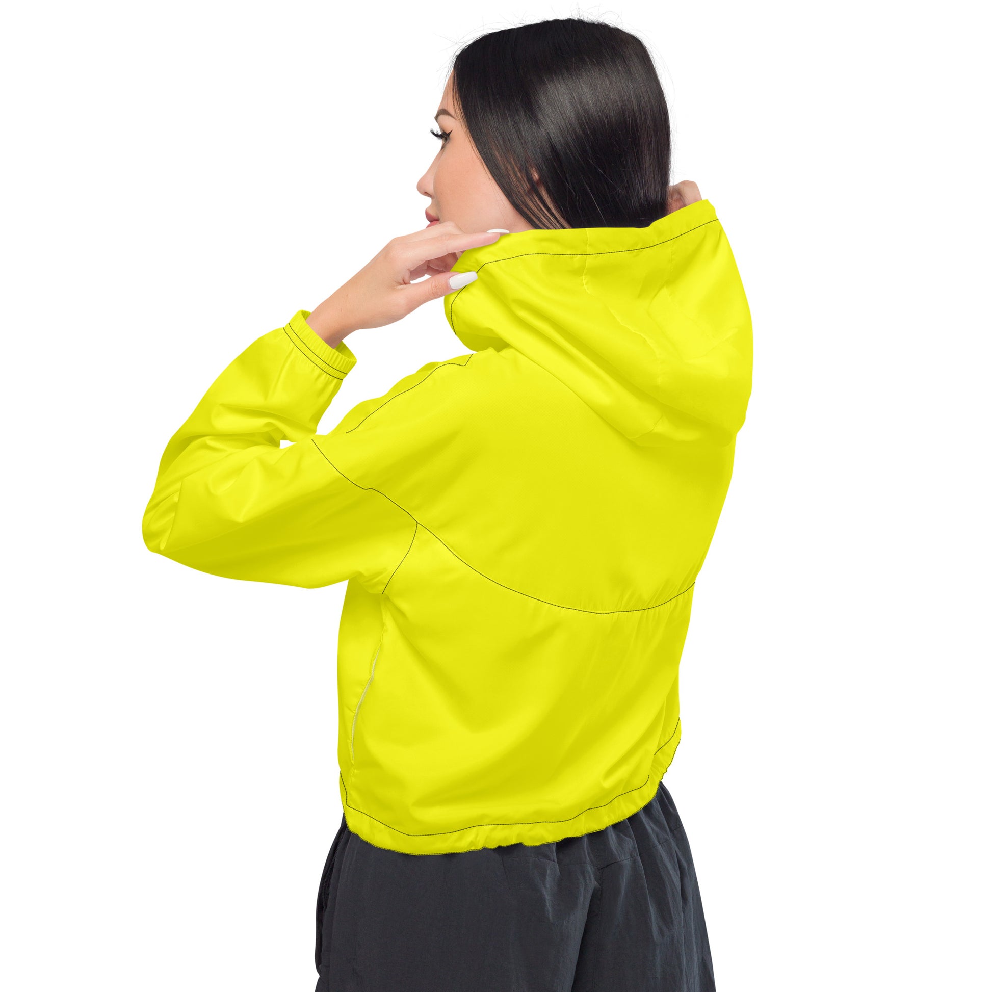 Woman wearing yellow cropped jacket.