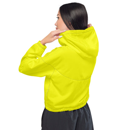 Woman wearing yellow cropped jacket.