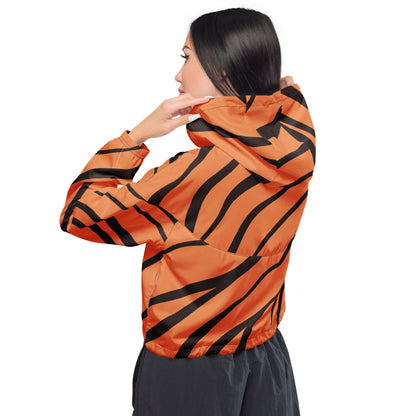 Woman wearing cropped jacket with tigerskin pattern.