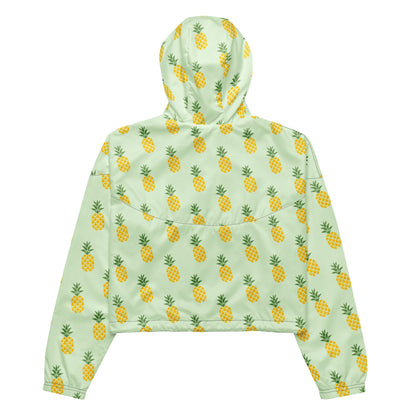 Back of jacket with pattern of pineapples set on a light-green background.