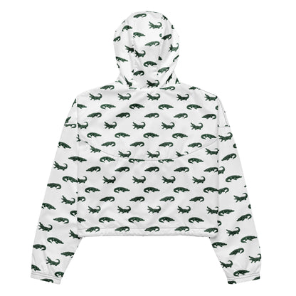 White, cropped windbreaker with pattern of green alligators.