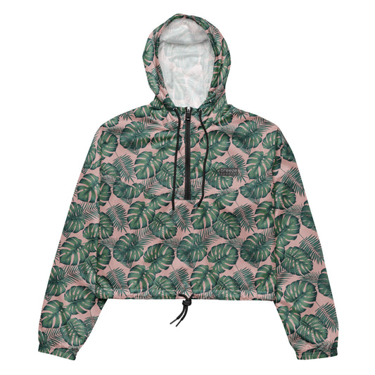 Cropped jacket with pattern of green palm leaves set on a pink background.
