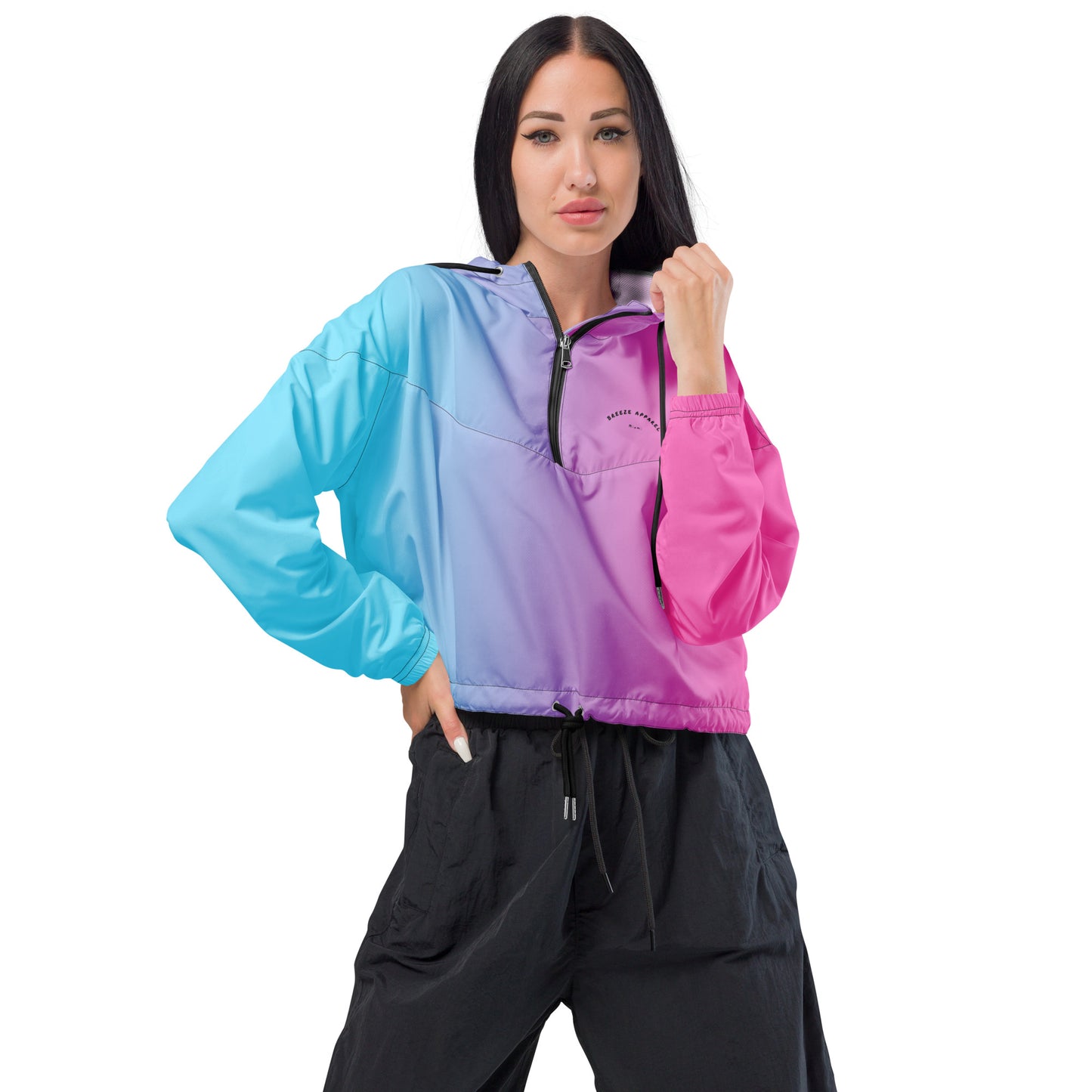 Woman wearing cropped jacket with color scheme that fades from light blue, to purple, to pink.