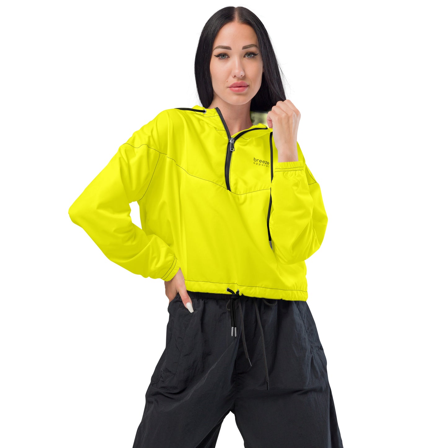 Woman wearing yellow cropped jacket.