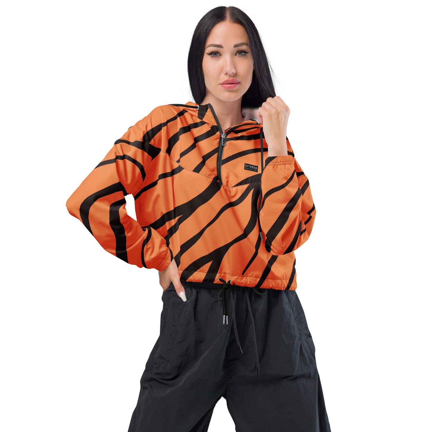 Woman wearing cropped jacket with tigerskin pattern.