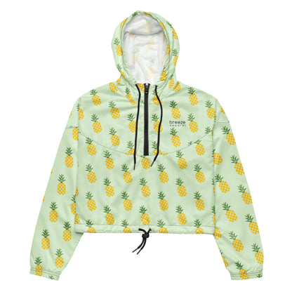 Jacket with pattern of pineapples set on a light-green background.