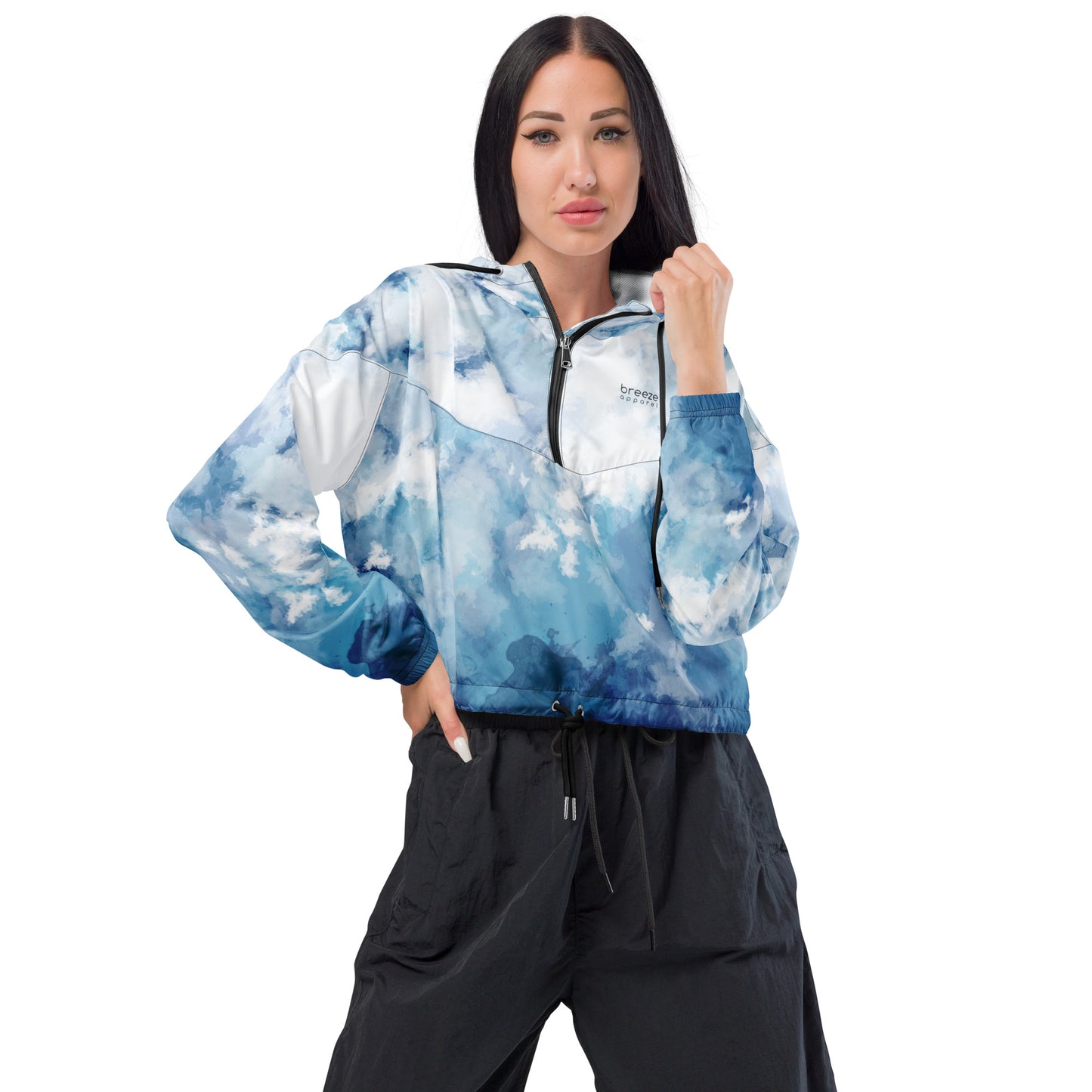 Woman wearing cropped jacket with blue-white watercolor pattern.