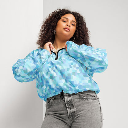 Woman wearing cropped jacket with light-blue geometric pattern.