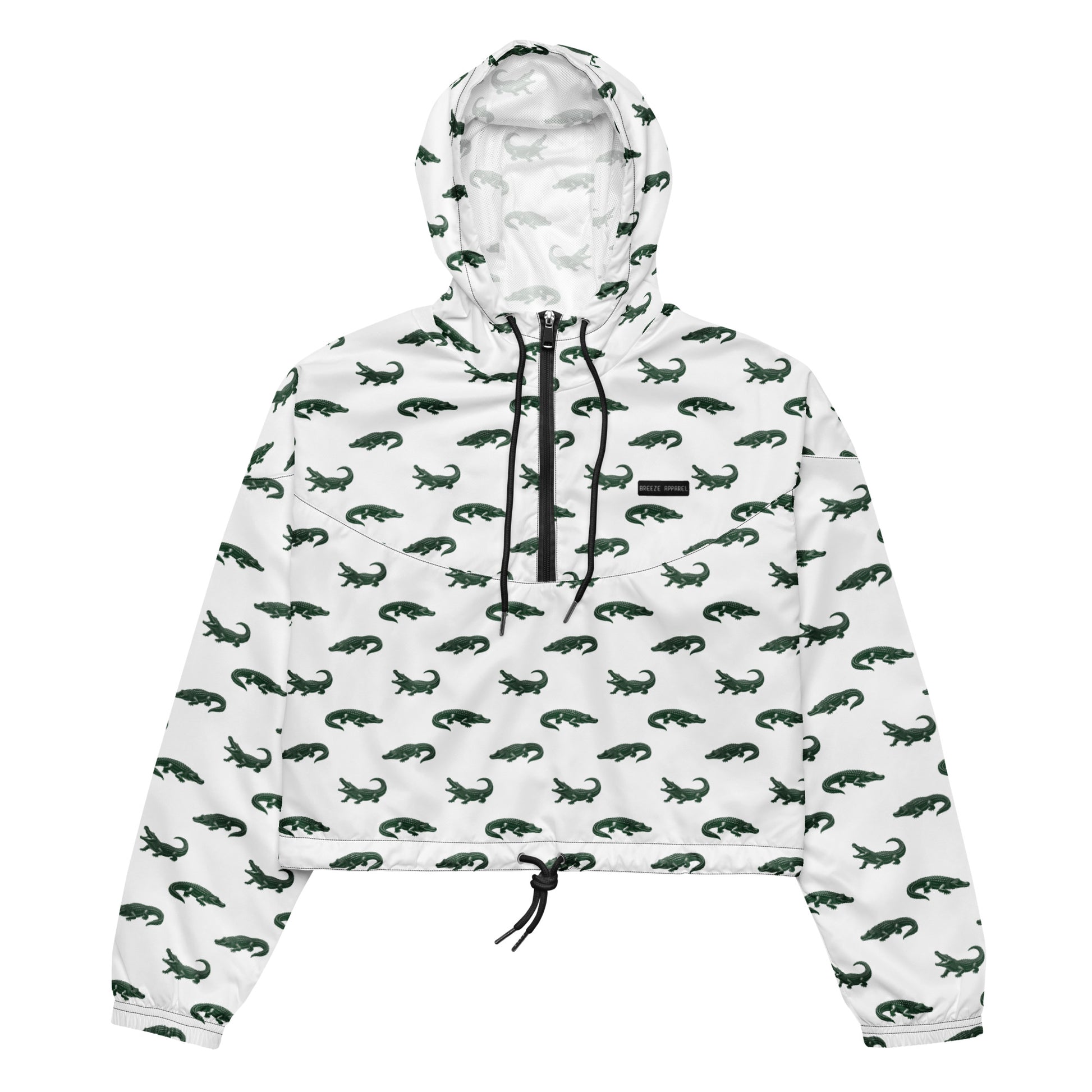 White, cropped windbreaker with pattern of green alligators.