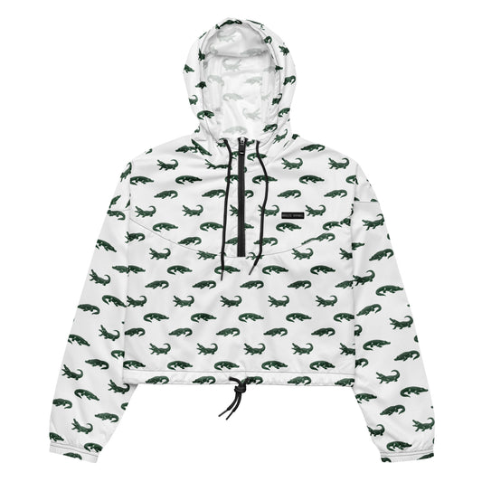 White, cropped windbreaker with pattern of green alligators.