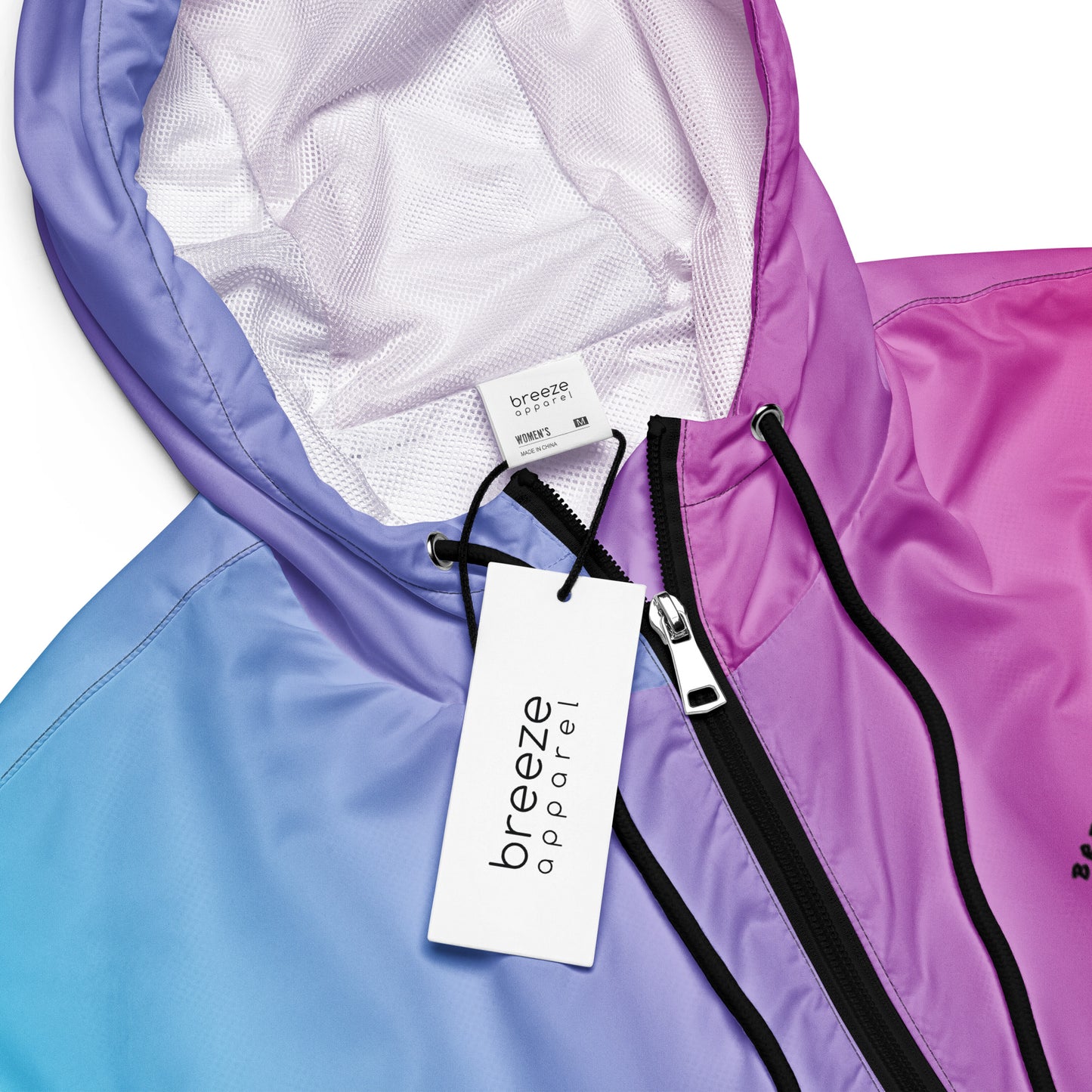 Jacket with color scheme that fades from light blue, to purple, to pink.