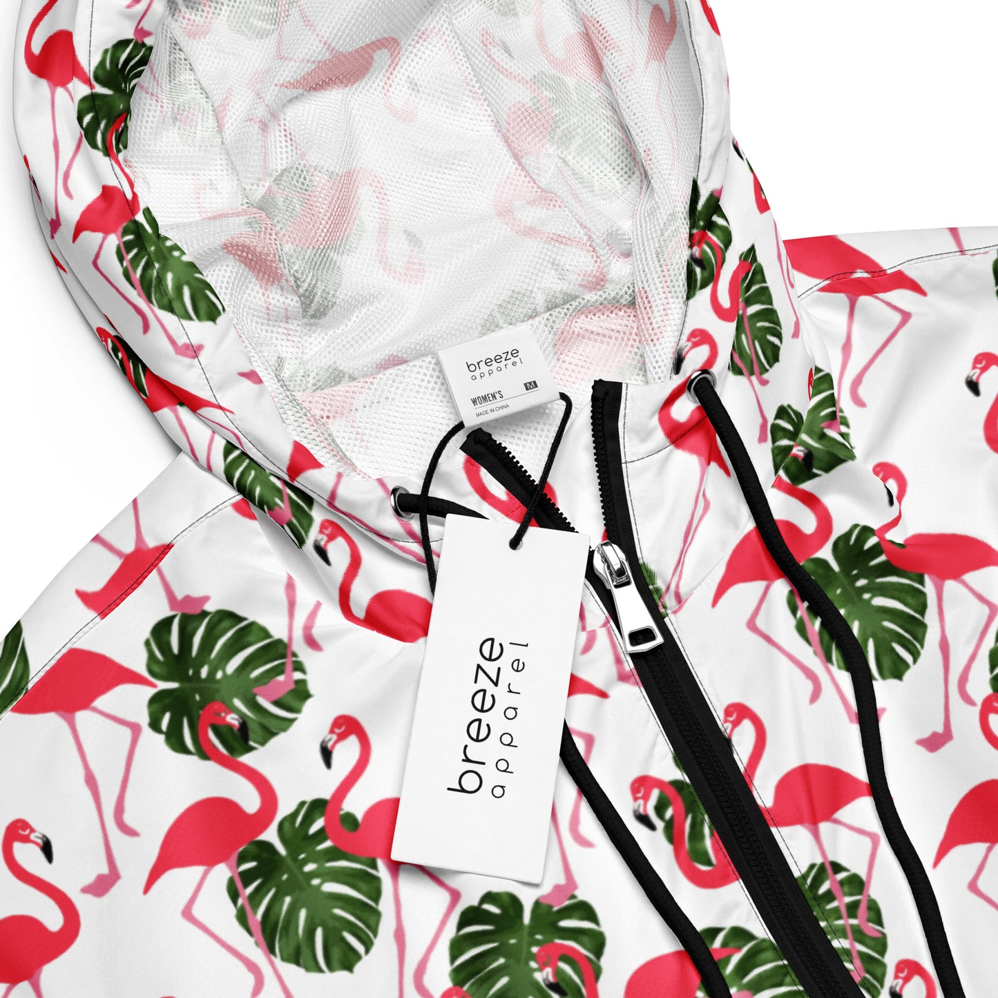 Jacket with pattern of flamingos on a white background.