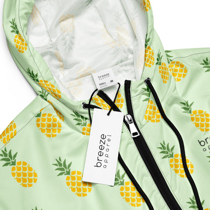 Jacket with pattern of pineapples set on a light-green background.
