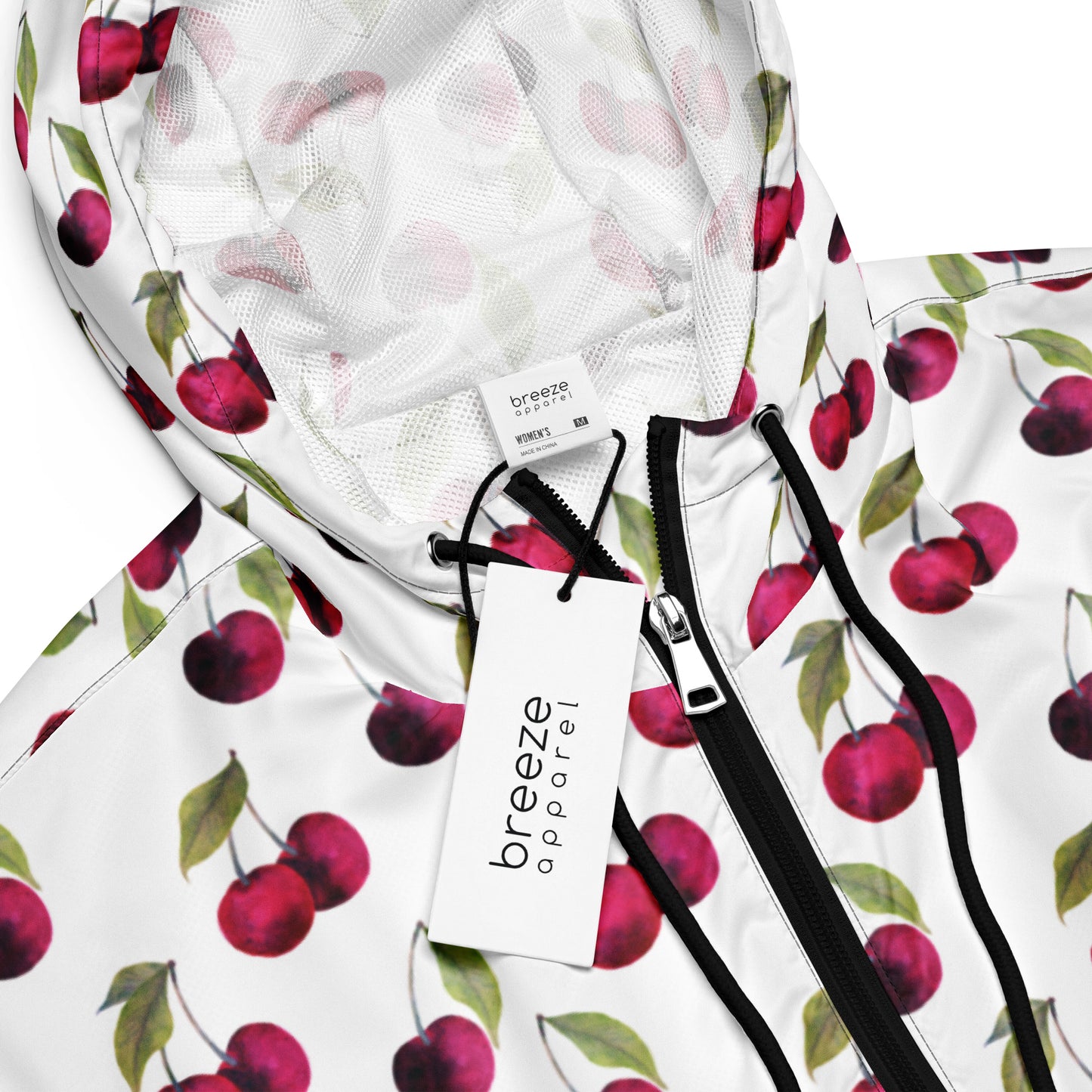 Jacket with pattern of cherries on a white background.