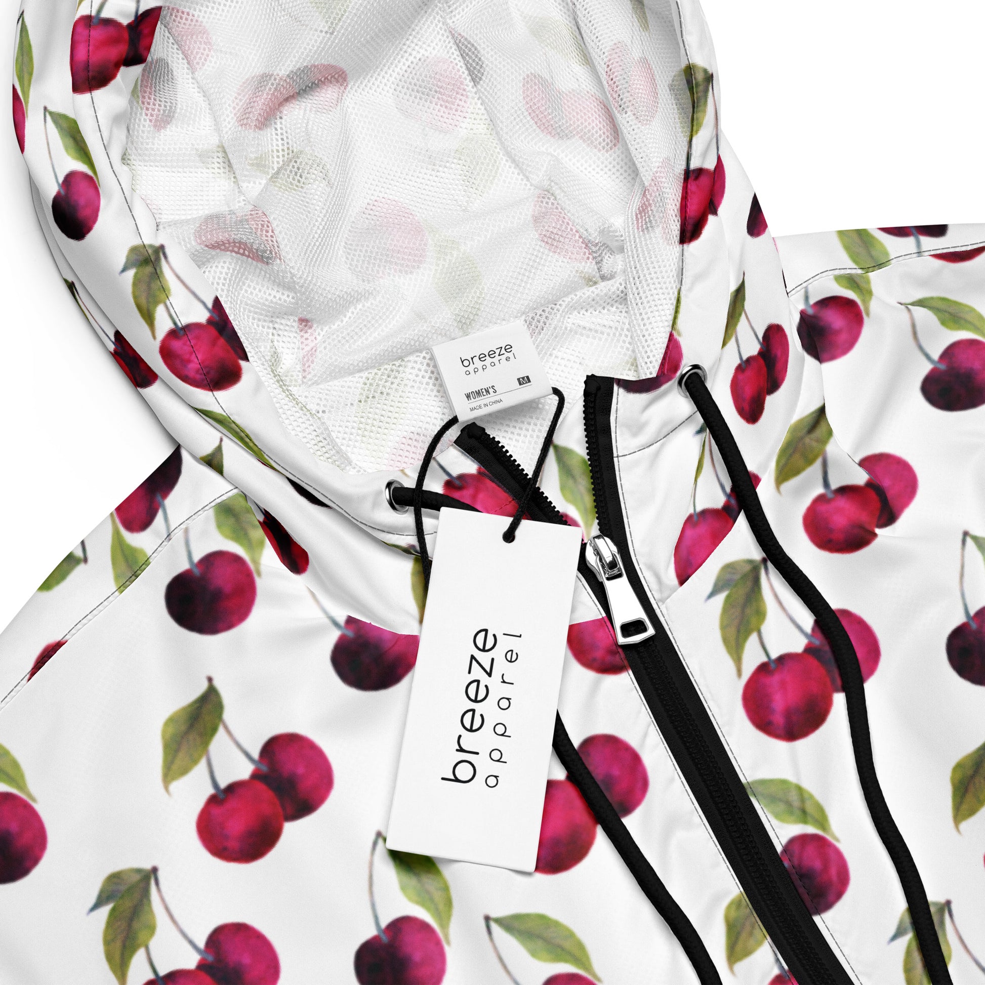 Jacket with pattern of cherries on a white background.